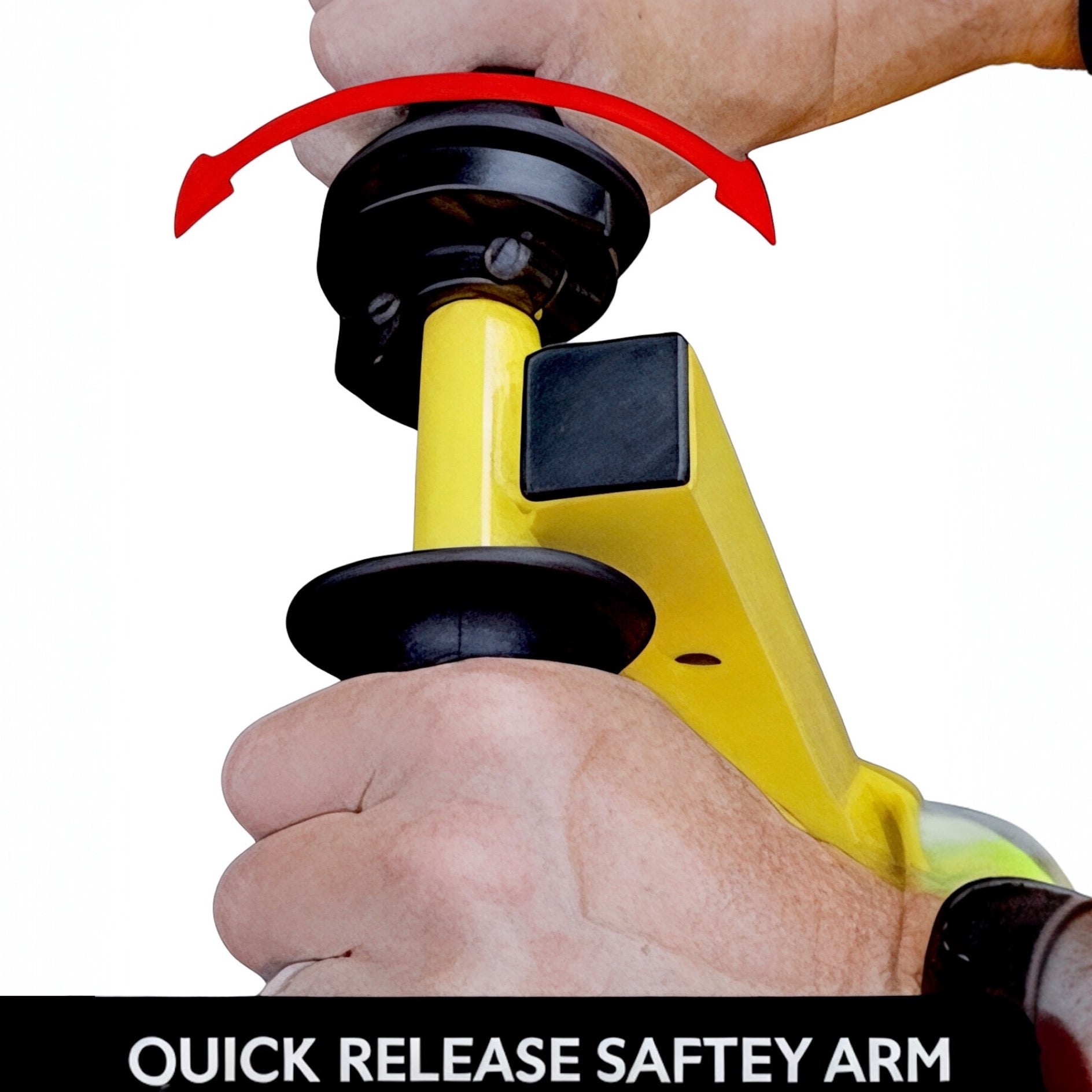 Hands adjusting the quick-release safety arm on a yellow mower lift.