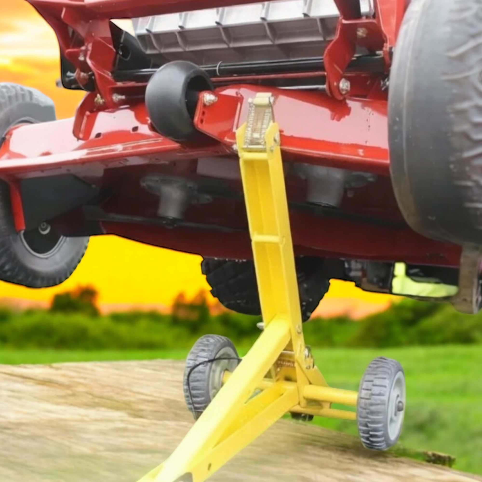 A Jungle Jack mower lift holding up a commercial mower.