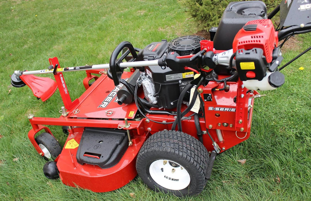 A red mower trimmer rack attached to a lawn mower, designed to hold a trimmer for convenient and secure transport.