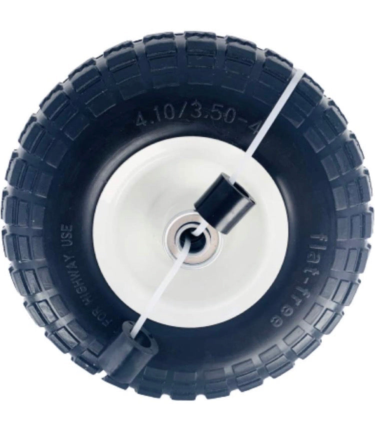 A flat-free utility tire pre-mounted on a steel wheel, predominantly black in color with a white inner wheel.