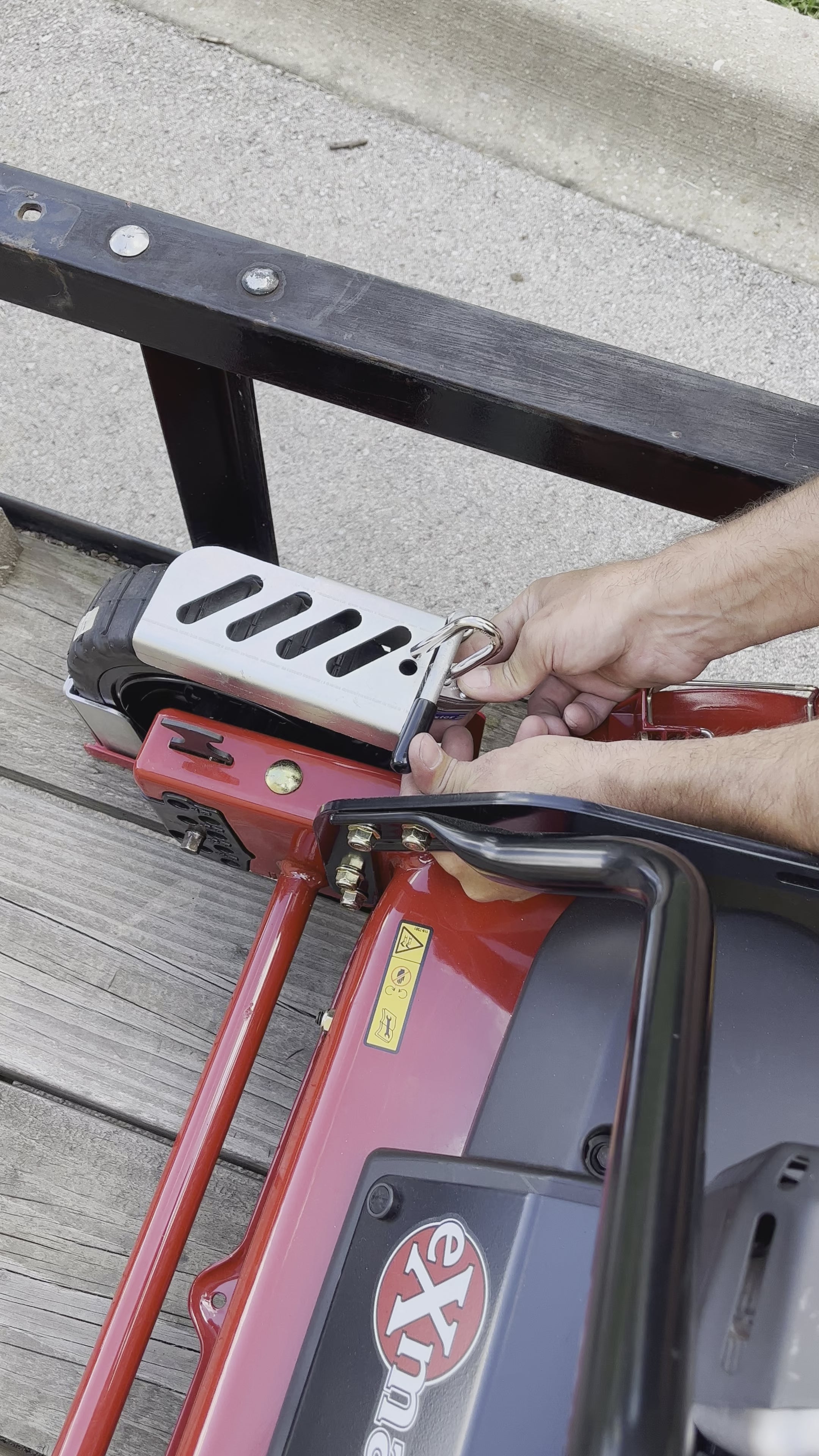 Load video: Jungle Jim&#39;s Jungle Boot Small with Locking Mechanism to Secure Push and Some Commercial Mowers to Lawn and Landscape Trailer